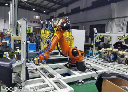 Automobile Bumper Processing Workstation With Robot End Effectors